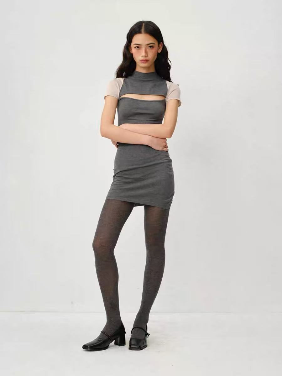 Full-length styled pose in the grey cutout dress
