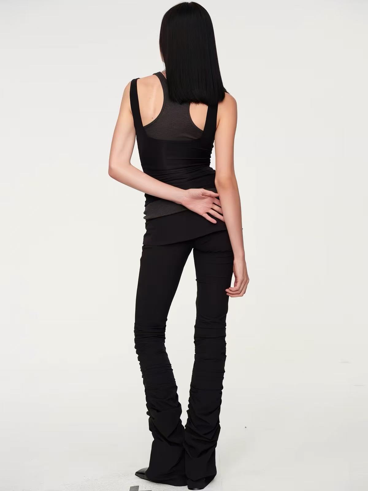 Back view of the layered black outfit