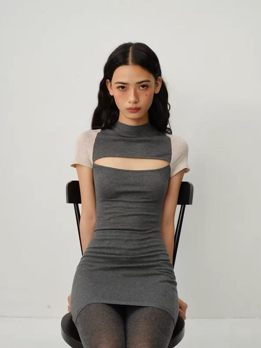 Seated front view of the grey cutout dress