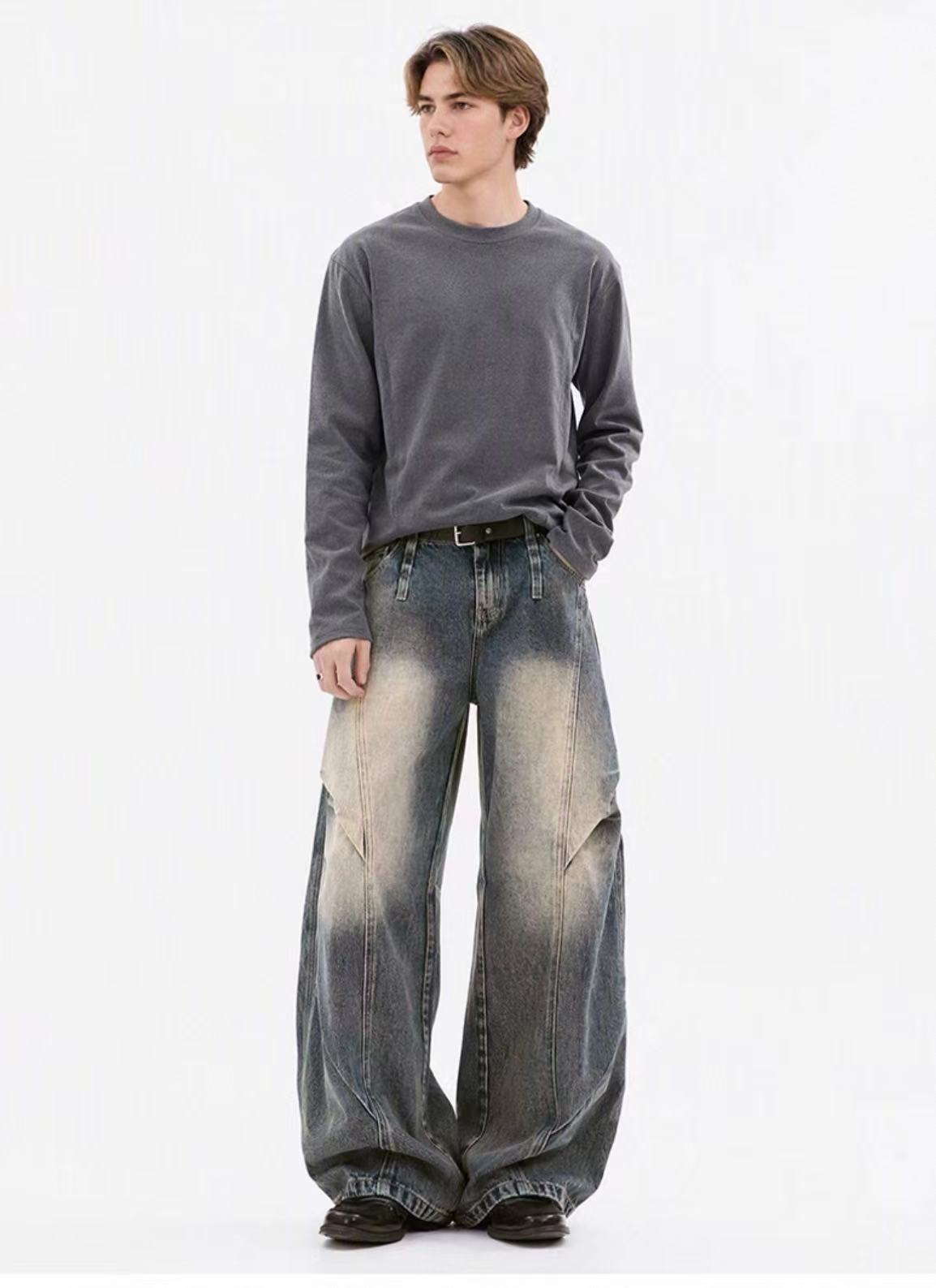 Full-length grey top and wide-leg washed denim styling