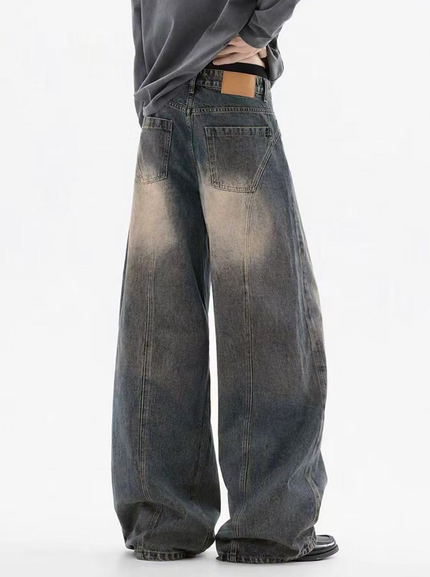 Back detail of washed denim trousers